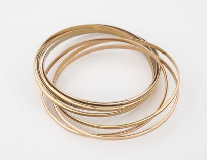 CARTIER, Paris Bracelet composed of 7 bracelets in gold (750) of three tones. 

Weight...