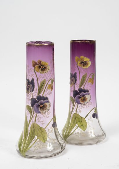 null A pair of colorless and violet glass vases with polychrome enamelled flowers....