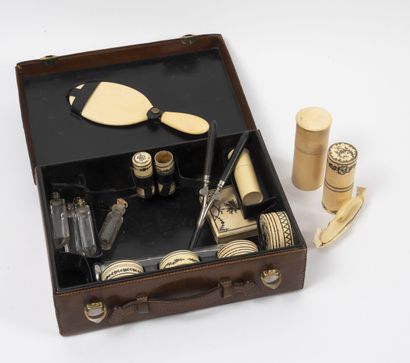null Toiletries (recomposed), contained in a small brown and black leather case,...