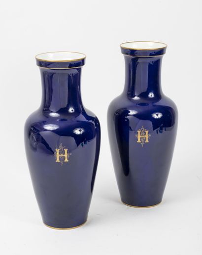 SEVRES, 1894 Pair of blue porcelain baluster vases with flat bottoms.

Decorated...