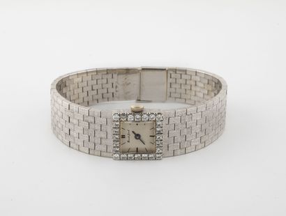 BUECHE-GIROD Montre bracelet de dame en or gris (750).

Cadran à fond argenté, signé,...
