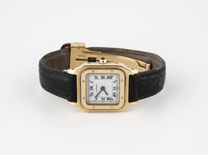 CARTIER "Santos" Ladies' wristwatch in yellow gold (750).

White enamelled dial,...