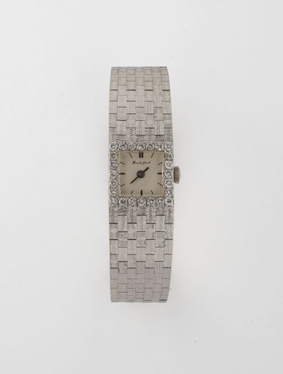 BUECHE-GIROD Montre bracelet de dame en or gris (750).

Cadran à fond argenté, signé,...