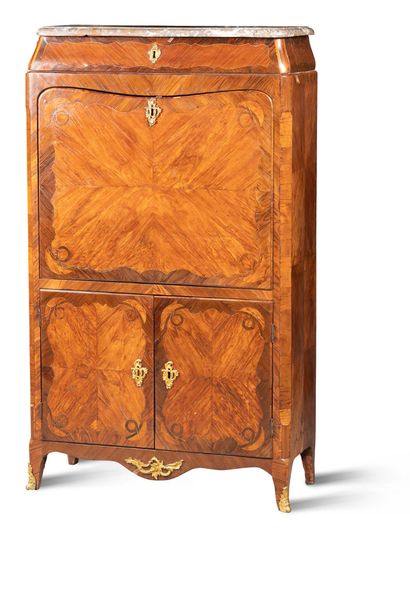 A rosewood veneered cupboard with butterfly...
