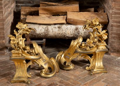 Pair of gilt bronze andirons with scrolls...