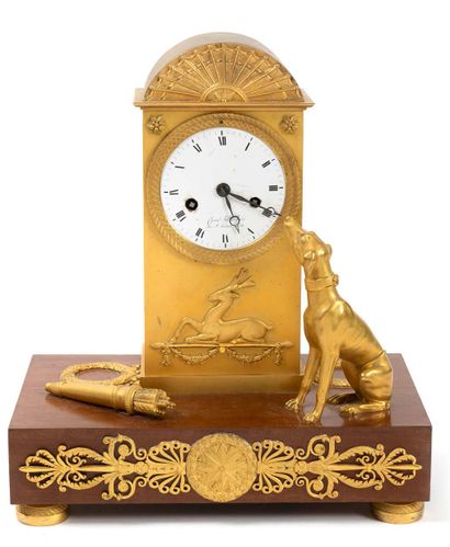 A gilt bronze and brass clock, decorated...