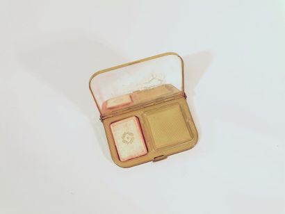Coty A gilt metal compact with bells, stamped and grooved with a drapery pattern.

Including...