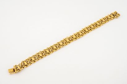 null Bracelet articulé en or jaune (750) à maille fantaisie et pastilles. 

Fermoir...