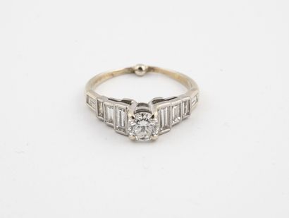  Rhodium-plated yellow gold solitaire ring centered on a brilliant-cut diamond in...