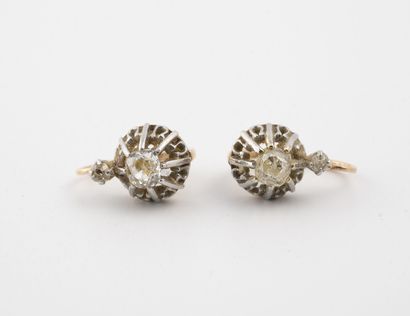 null Pair of yellow and white gold (750) dormeuses of conical shape centered by an...