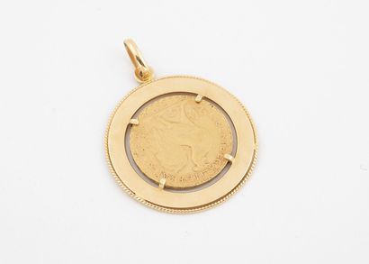 null Yellow gold pendant (750) holding a 20 francs gold coin, IIIrd republic, 1909....