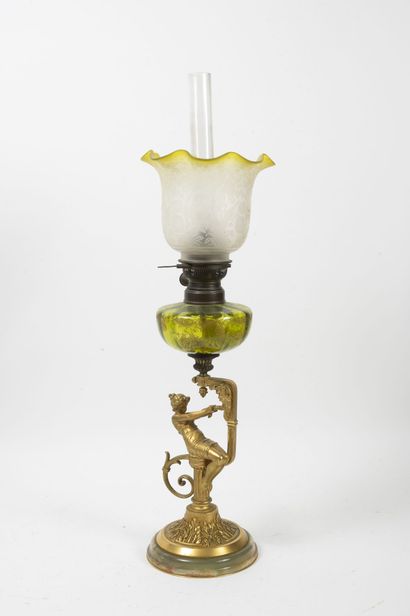 null Kerosene lamp, the foot in gilded patinated bronze decorated with woman and...