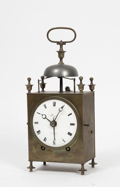 FRANCE, vers 1820-1830 Clock called capucine in brass, resting on four feet toupies....