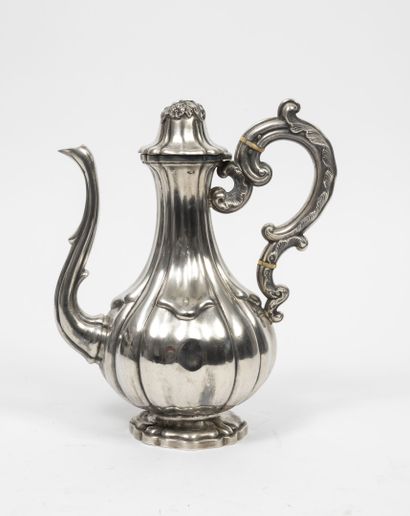 null Two pourers on pedestal in silver (950).

One with a blackened wood grip, the...