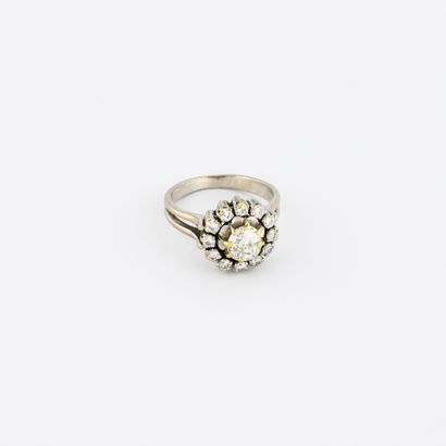 
Rhodium-plated yellow gold flower ring centered...