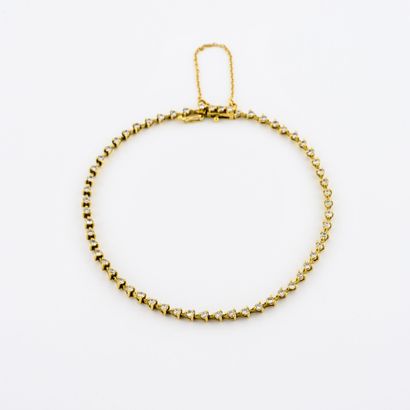 null Line bracelet in yellow gold (750) decorated with small brilliant diamonds in...