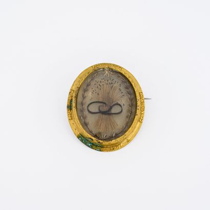 Oval brooch in gilded metal with central...