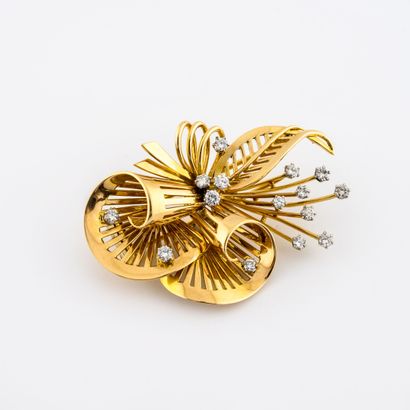 null 
Lapel clip in the shape of a spray of flowers with a large ribbon wound in...