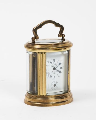 L'ÉPÉE, Sainte Suzanne, L'Ovale Glass and gilt brass elliptical cage clock with top...