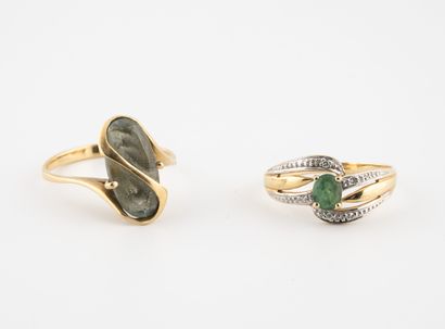 
Two yellow gold (750) rings set with a small...