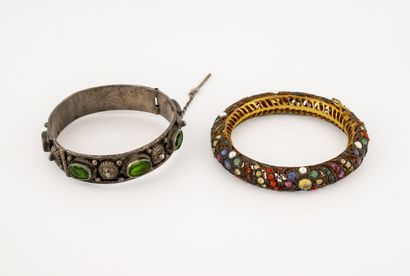 Set of two metal bracelets decorated with...