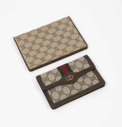 GUCCI Lot including: 

- Supreme GG canvas and brown leather wallet.

Signed inside...