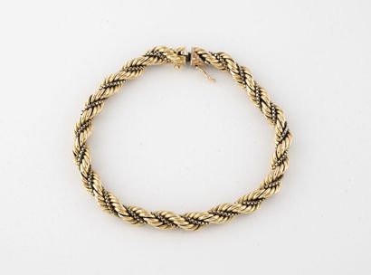 null Yellow gold bracelet (750) with a rope link holding a Venetian link. 

Ratchet...