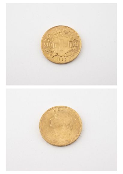 SUISSE Une pièce de 20 francs or, Helvetia, 1935.

Poids : 6.44 g.

Usures.
