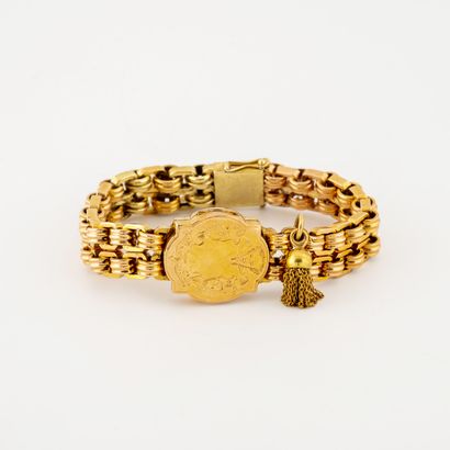 null Articulated bracelet in yellow gold (585) centered on a medallion photo holder...