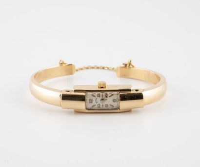 COMEX Lady's wristwatch in yellow gold (750).

Rectangular case.

Dial with iridescent...