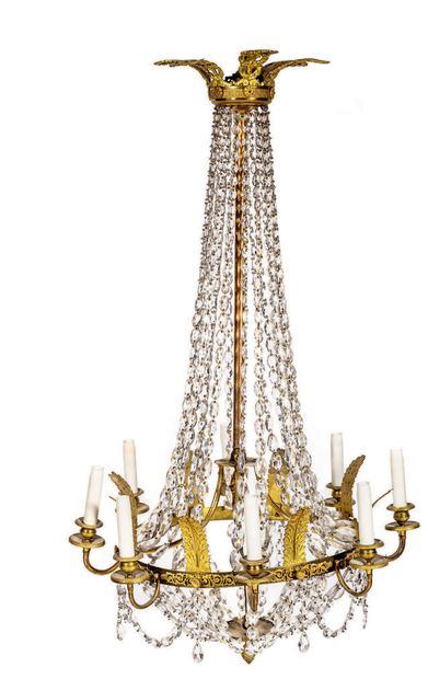 A gilded bronze and brass eight-light chandelier...