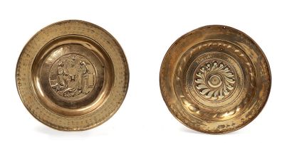  Dishes of offerings. In embossed and hallmarked brass, one decorated with the Annunciation...