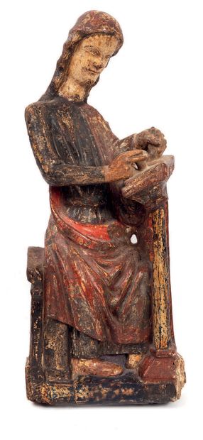  Saint Jean évangéliste. En bois sculpté en demie ronde-bosse, polychromé et doré....
