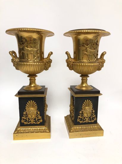 null Pair of ormolu Medici vases with handles with bearded heads, and the body decorated...