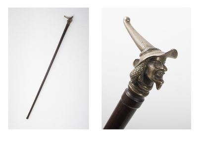 Wooden cane with its silver-plated bronze...
