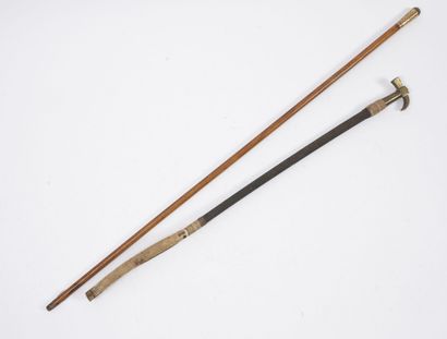 null Rider's whip sheathed in black braid, with white leather strap, with brass hammer...