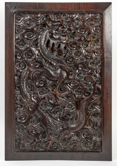 INDOCHINE, fin XIXème-début du XXème siècle Two panels in exotic wood carved with...