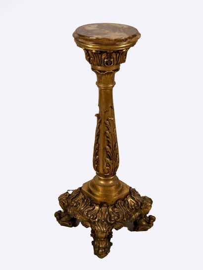 null A gold patina resin saddle with a leafy shaft supporting a capital with a circular...