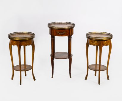 Three small circular pedestal tables, including...
