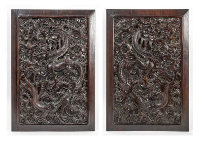 INDOCHINE, fin XIXème-début du XXème siècle Two panels in exotic wood carved with...