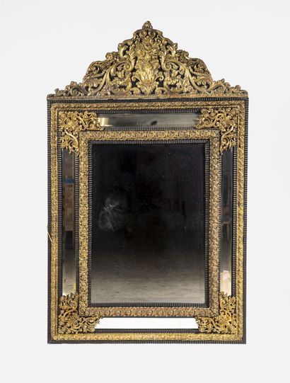 null Rectangular mirror with pediment and bevelled glass, in blackened wood decorated...