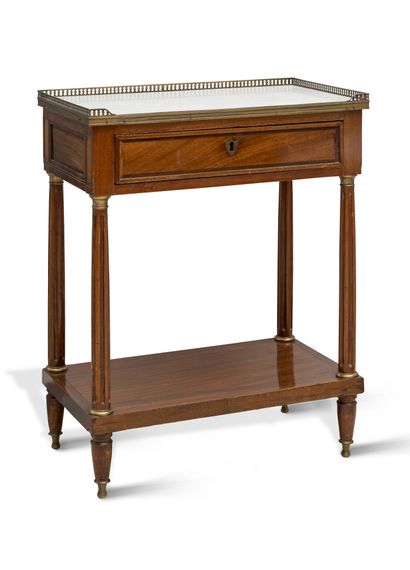 null Mahogany veneered and solid molded console table, opening with a drawer in the...