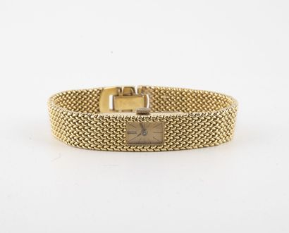  Elégante montre bracelet de dame en or jaune (750). 
Boîtier rectangulaire 
Cadran...