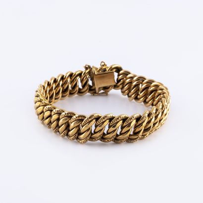 Bracelet en or jaune (750) à maille américaine...