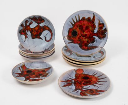 VALLAURIS Part of a table service decorated with fish and marine animals.

In enamelled...