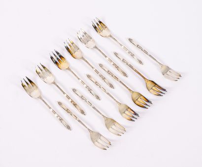 ERCUIS Series of twelve silver plated cake forks with decorated handles. 

Hallmark...