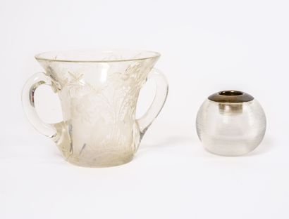 Two pieces in colorless glass:

- Vase with...