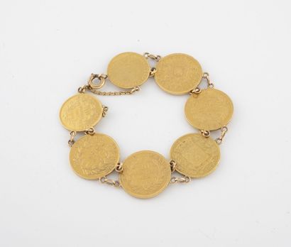 null Bracelet articulé en or jaune (750) composé de cinq pièces de 20 francs or et...