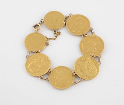 null Bracelet articulé en or jaune (750) composé de cinq pièces de 20 francs or et...