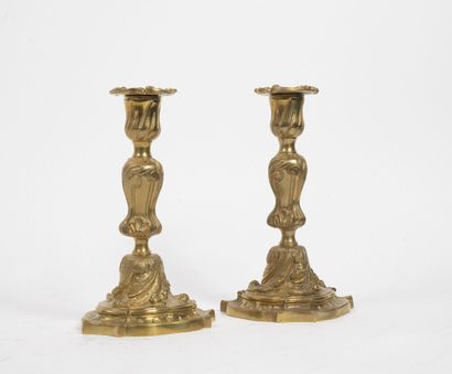 null Pair of bronze torches in rocaille style with acanthus leaves and staples.

Late...